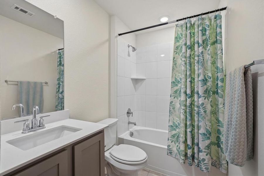 Full bath with shower / bathtub combination with curtain and vanity Full bath with shower / bathtub combination with curtain and vanity