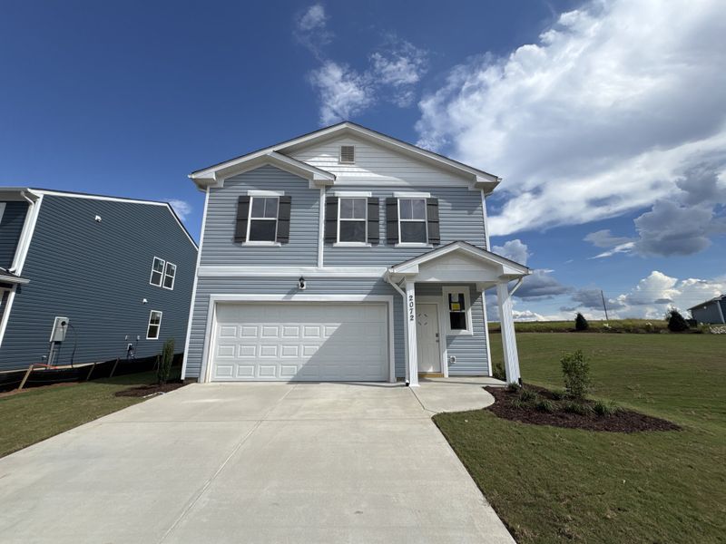 Front exterior of a new home in Declaration Homes at Tillery Park West, Grovetown, GA, highlighting curb appeal (Image 2). Front exterior of a new home in Declaration Homes at Tillery Park West, Grovetown, GA, highlighting curb appeal (Image 2).