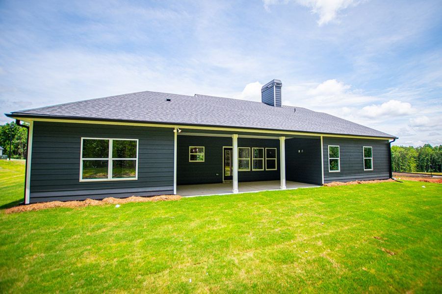 Exterior details and patio area of a home in WOODMONT RESERVE, Roopville (Image 42).