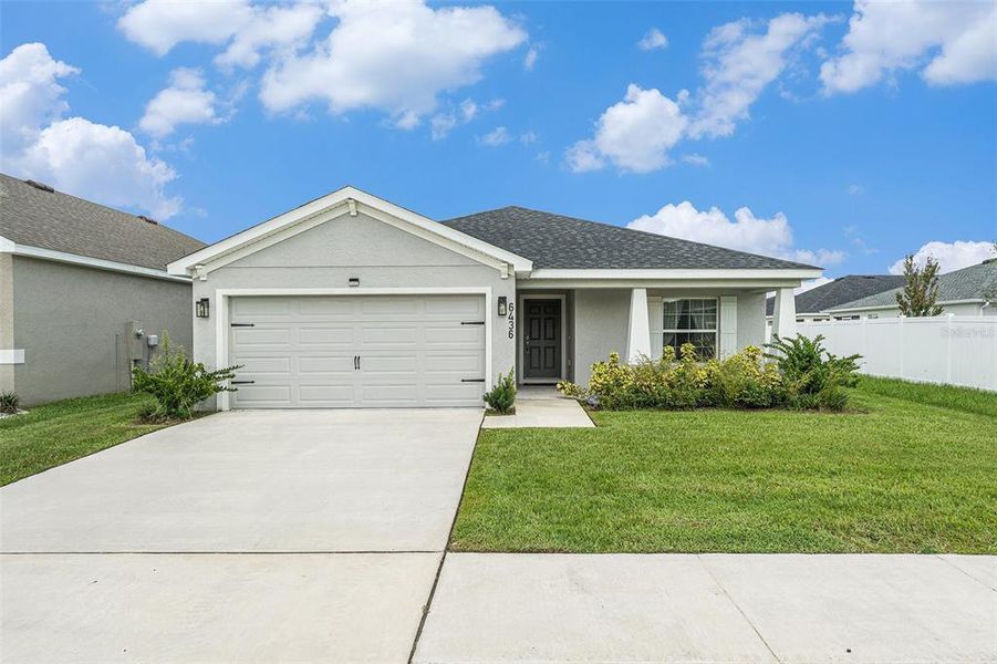 Front exterior of a new home in , Zephyrhills, FL, highlighting curb appeal (Image 18).