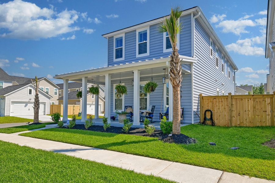 Front exterior of a new home in Heron's Walk at Summers Corner, Summerville, SC, highlighting curb appeal (Image 2).