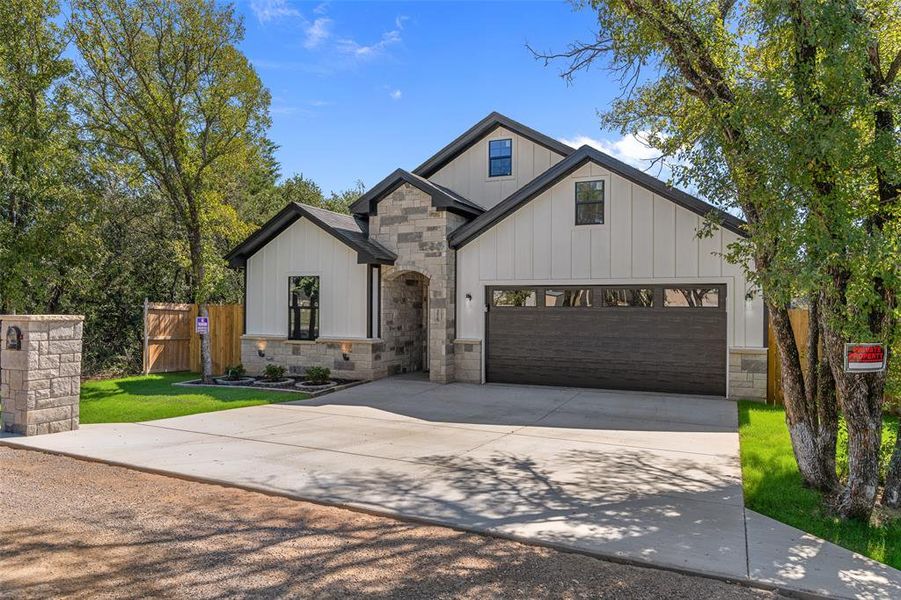 Front exterior of a new home in , Granbury, TX, highlighting curb appeal (Image 20).