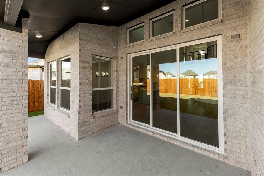 Exterior details and patio area of a home in Valencia on The Lake, Little Elm (Image 23).