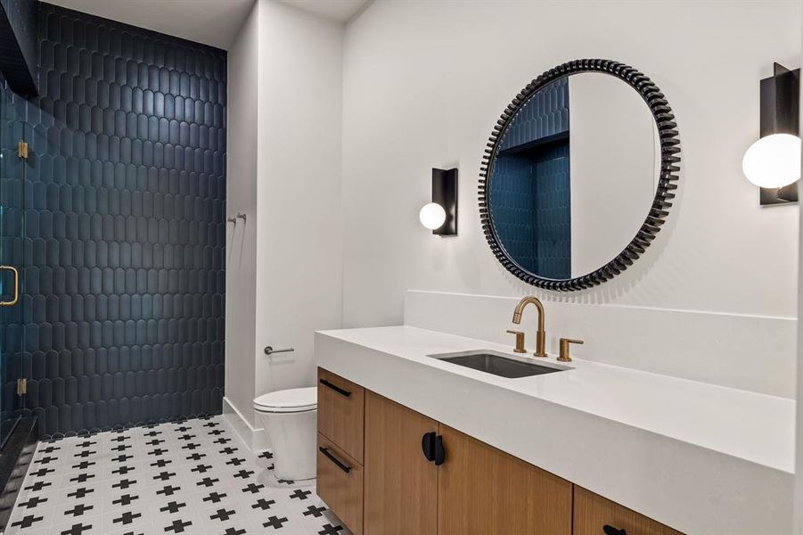 Full bathroom featuring vanity and tiled shower Full bathroom featuring vanity and tiled shower