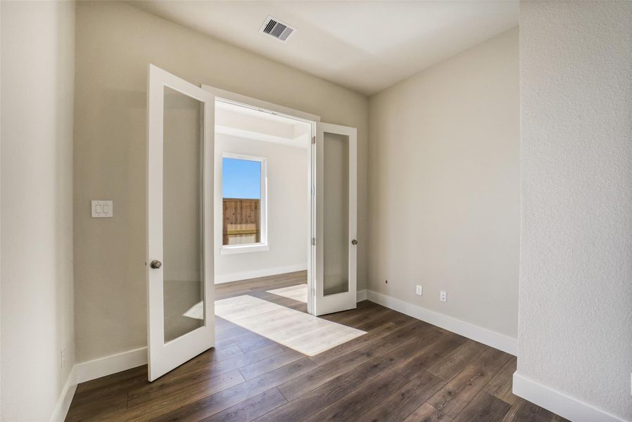 Spacious, unfurnished interior of a new home in Sunterra, Katy (Image 41).
