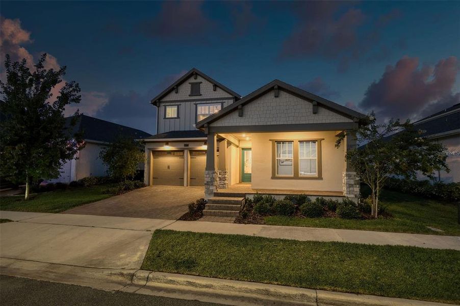 Front exterior of a new home in Laureate Park, Orlando, FL, highlighting curb appeal (Image 24). Front exterior of a new home in Laureate Park, Orlando, FL, highlighting curb appeal (Image 24).