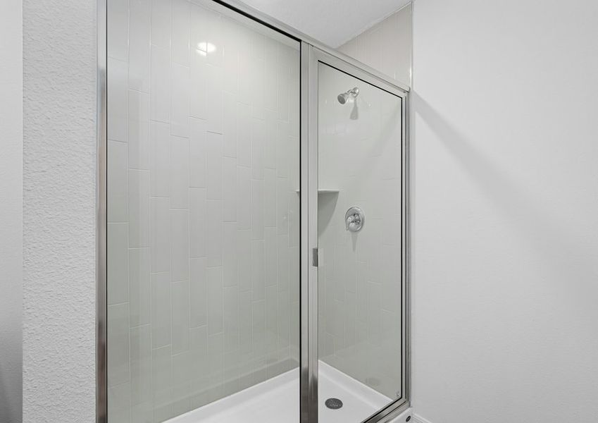 The master bathroom has a beautifully tiled shower