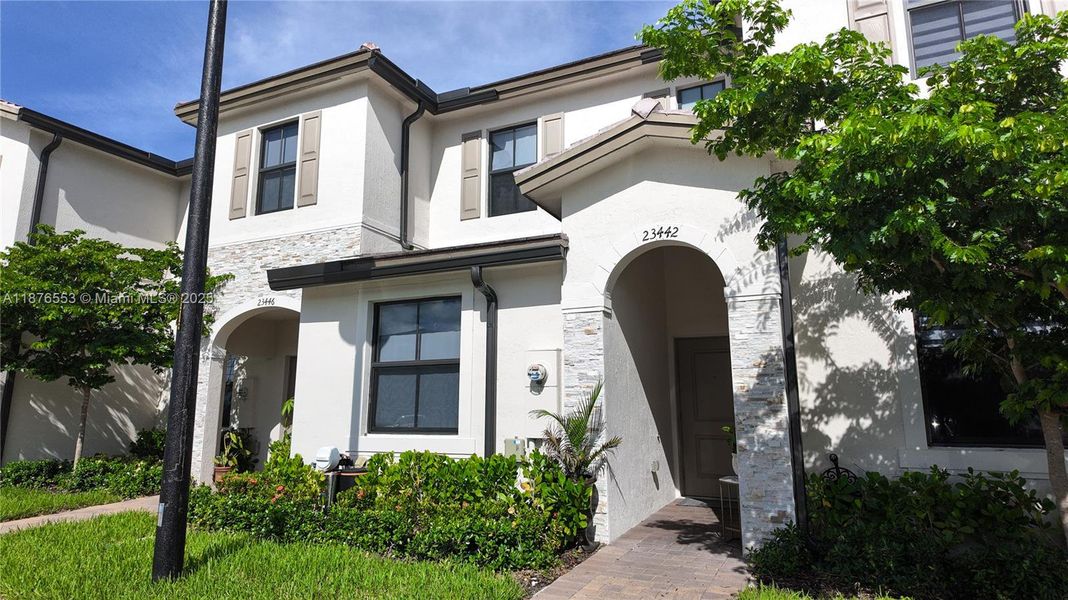 Front exterior of a new home in , Homestead, FL, highlighting curb appeal (Image 2). Front exterior of a new home in , Homestead, FL, highlighting curb appeal (Image 2).