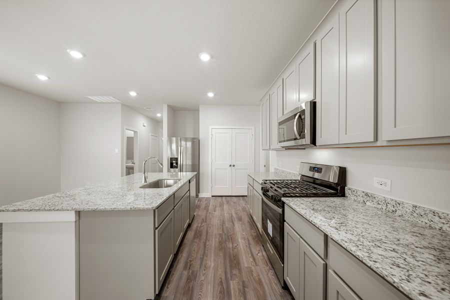 A kitchen with white cabinets. A kitchen with white cabinets.