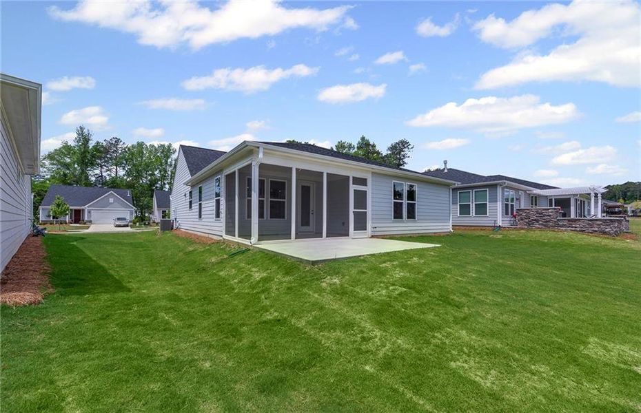 Front exterior of a new home in Sun City Peachtree, Griffin, GA, highlighting curb appeal (Image 14).