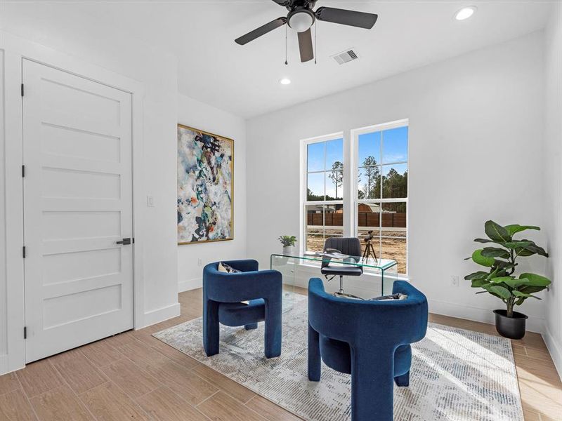 Your very own home office/flex space that oversees the front of the home, featuring awesome lighting and tons of outlet plugs.