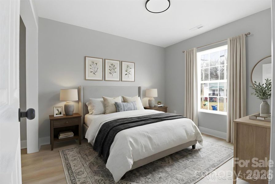 Walking into bedroom/flex room on the main floor (virtually staged/enhanced).