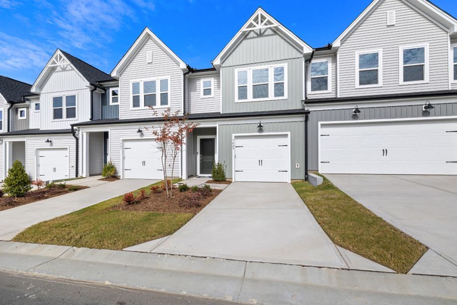 Front exterior of a new home in McConnell Ridge, McLeansville, NC, highlighting curb appeal (Image 17). Front exterior of a new home in McConnell Ridge, McLeansville, NC, highlighting curb appeal (Image 17).