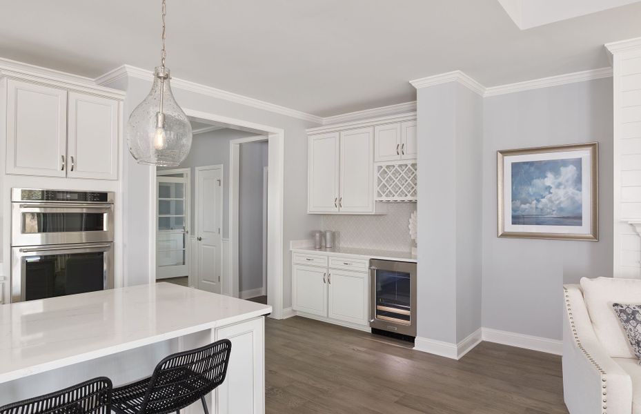 Optional Beverage Center with white cabinets, tile backsplash, wine refrigerator and wine storage areas. Optional Beverage Center with white cabinets, tile backsplash, wine refrigerator and wine storage areas.