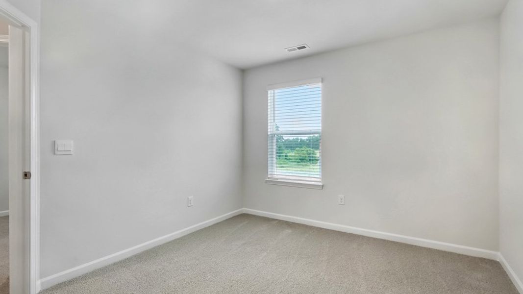 Spacious, unfurnished interior of a new home in The Townes at Honeycutt Oaks, Angier (Image 25).