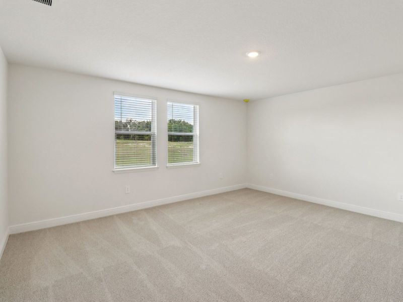 Spacious, unfurnished interior of a new home in The Reserve at Hammock Oaks - Signature Series, Lady Lake (Image 13).