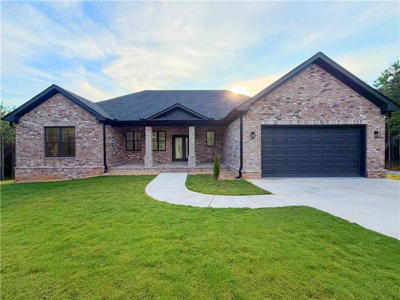Front exterior of a new home in , Forsyth, GA, highlighting curb appeal (Image 1). Front exterior of a new home in , Forsyth, GA, highlighting curb appeal (Image 1).