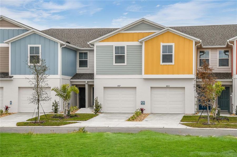 Front exterior of a new home in Grove at Crosswind, Haines City, FL, highlighting curb appeal (Image 1). Front exterior of a new home in Grove at Crosswind, Haines City, FL, highlighting curb appeal (Image 1).