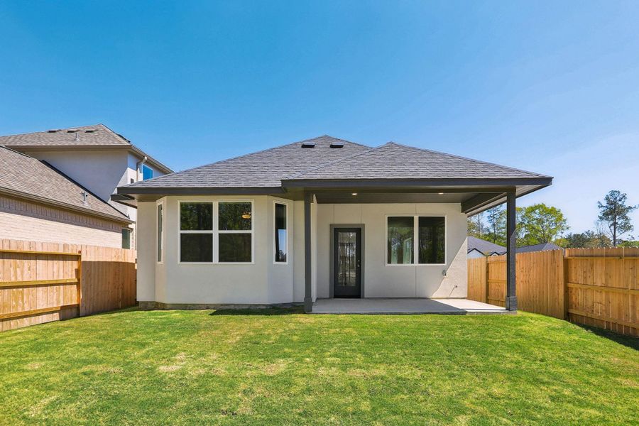 Exterior details and patio area of a home in Woodhavyn 40', Magnolia (Image 20).