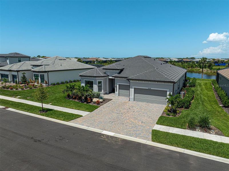 Front exterior of a new home in , Nokomis, FL, highlighting curb appeal (Image 20). Front exterior of a new home in , Nokomis, FL, highlighting curb appeal (Image 20).