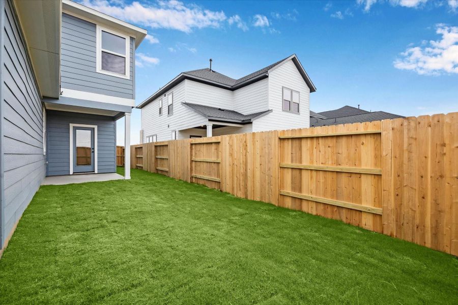 Exterior details and patio area of a home in Elyson, Katy (Image 21).