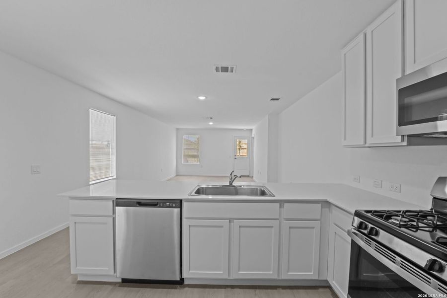 Furnished interior view inside a new home in Valle Sol, San Antonio (Image 8).