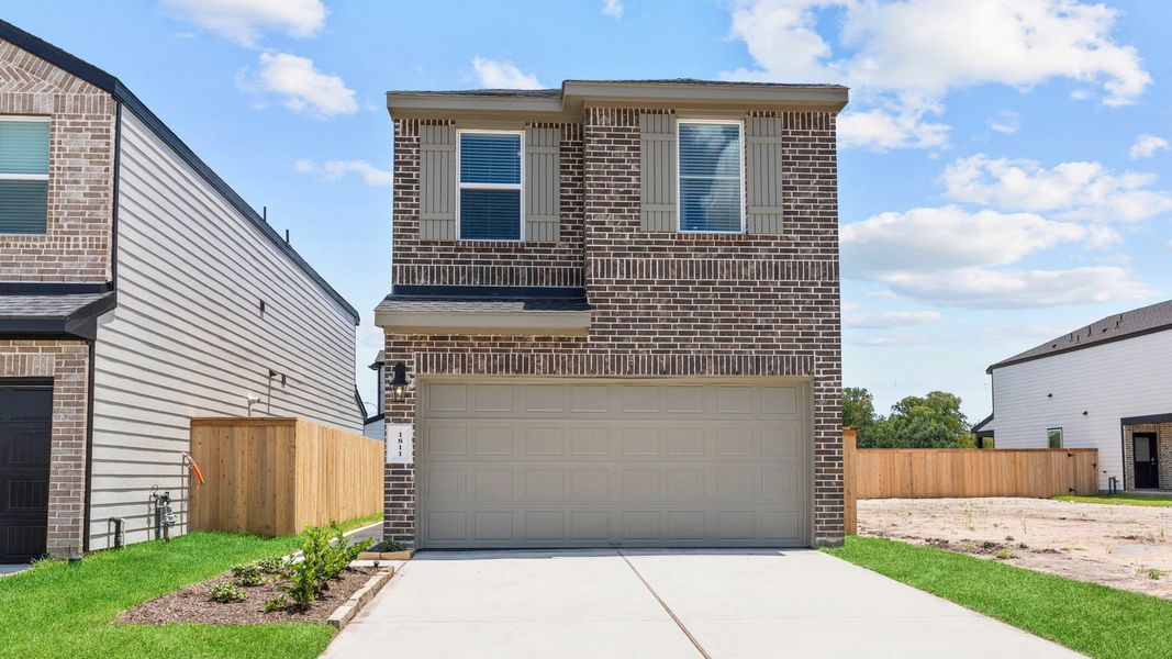 Front exterior of a new home in Lexington Village, Missouri City, TX, highlighting curb appeal (Image 1). Front exterior of a new home in Lexington Village, Missouri City, TX, highlighting curb appeal (Image 1).