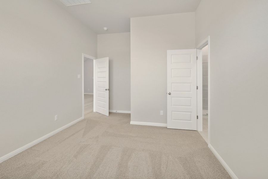 Primary Bedroom in the Ash home plan by Trophy Signature Homes – REPRESENTATIVE PHOTO
