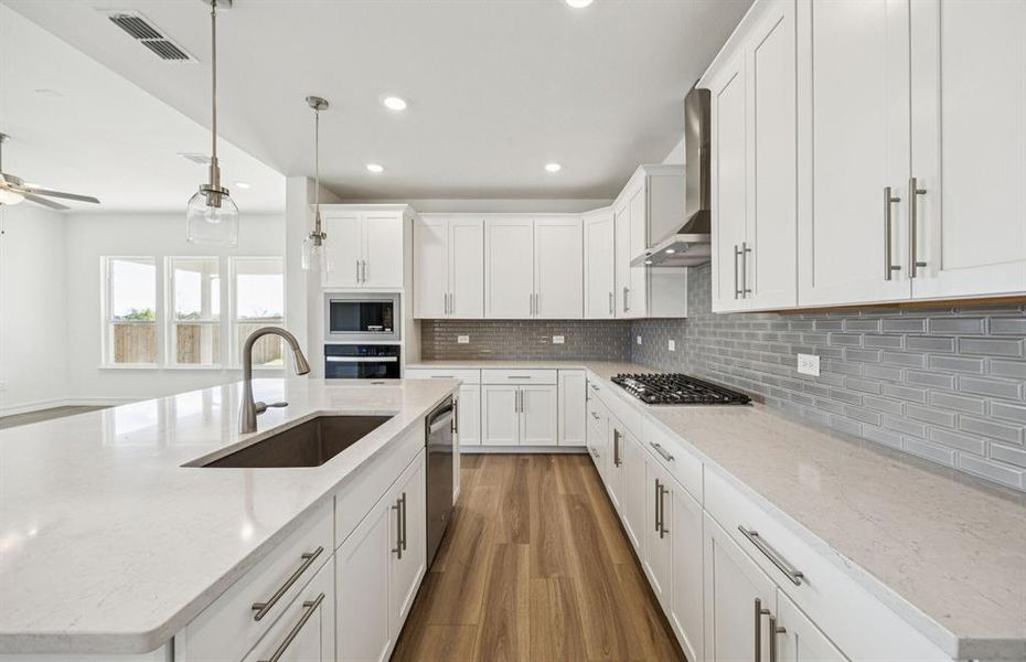 High-end gourmet kitchen with premium finishes and upgraded appliances High-end gourmet kitchen with premium finishes and upgraded appliances