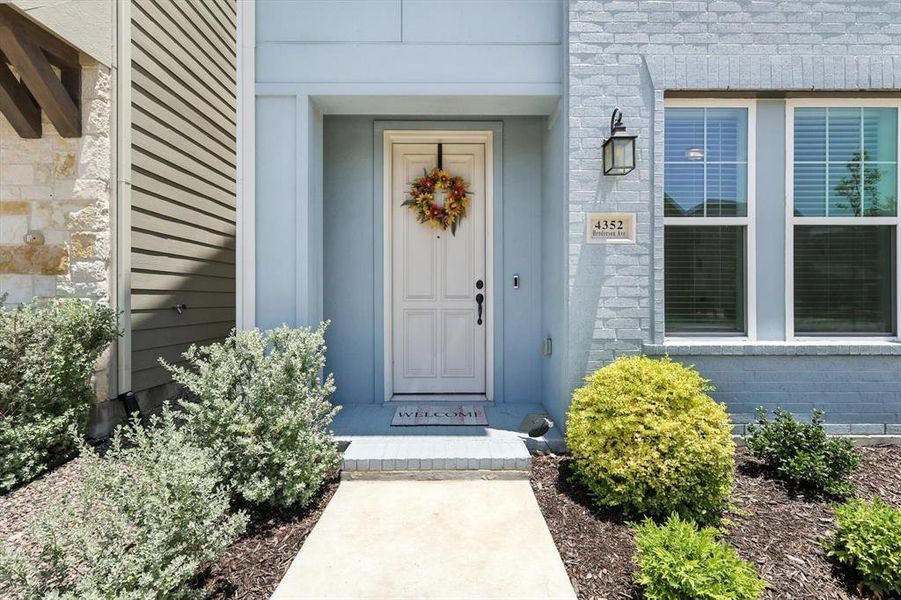 View of exterior entry with beautiful mahogany front door