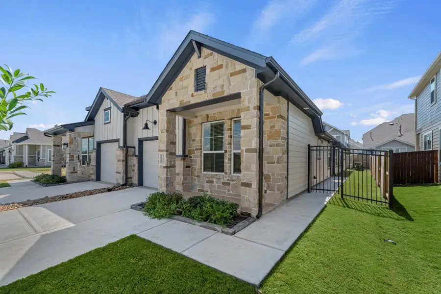 Exterior details and patio area of a home in Meridiana, Manvel (Image 2).