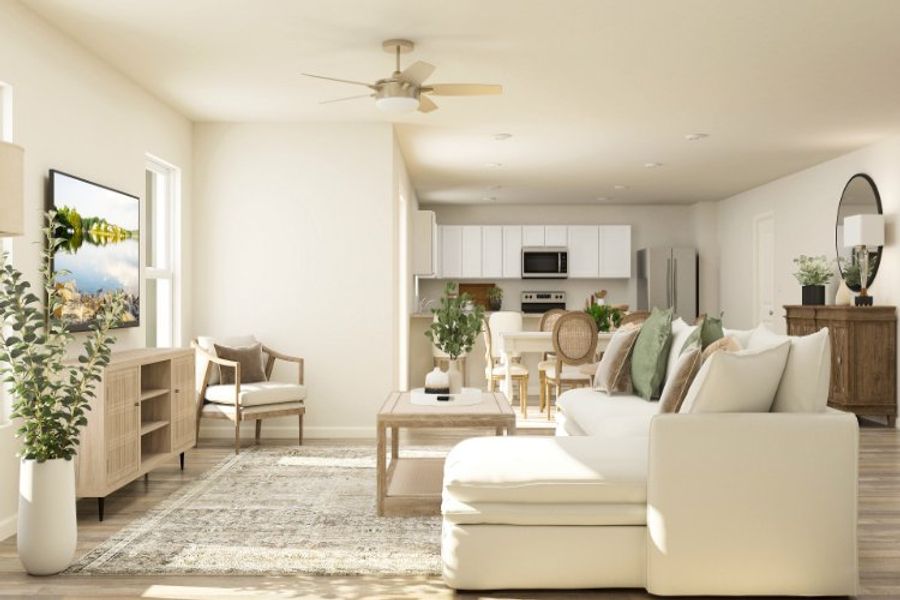 A living room with a white couch and a white table. A living room with a white couch and a white table.