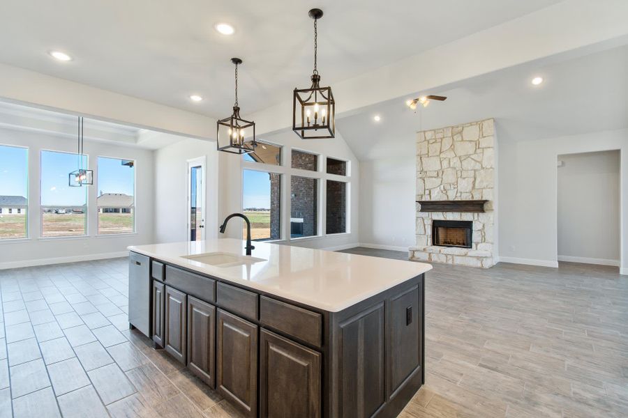 Kitchen & Family Room | Concept 3141 at Hidden Creek Estates in Van Alstyne, TX by Landsea Homes