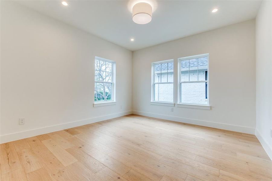 Unfurnished room with light wood-type flooring