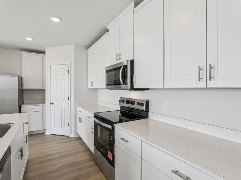 Furnished interior view inside a new home in Lake Deer Estates - Signature Series, Poinciana (Image 5).