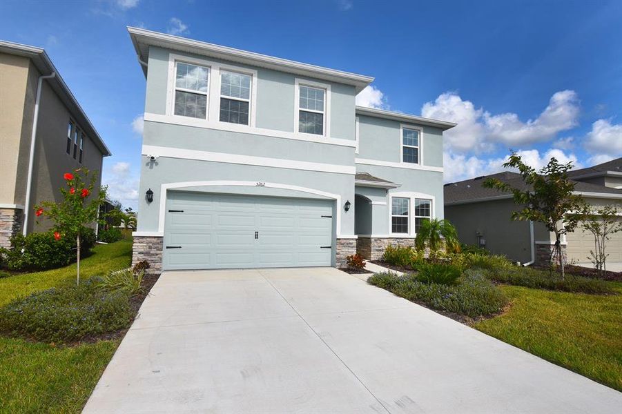 Front exterior of a new home in Solera at Lakewood Ranch, Lakewood Ranch, FL, highlighting curb appeal (Image 20).