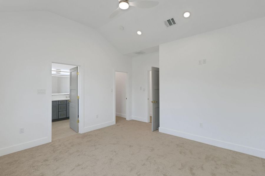Primary bedroom with walk-in closet and ensuite bath