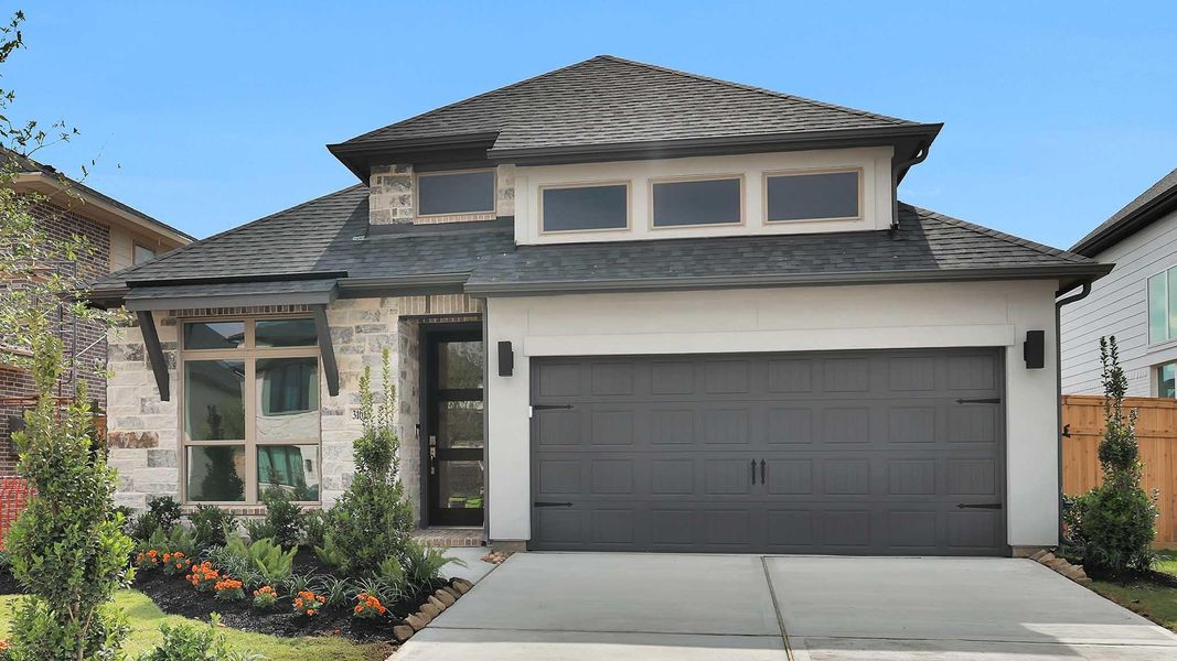 Front exterior of a new home in Cross Creek West, Fulshear, TX, highlighting curb appeal (Image 1). Front exterior of a new home in Cross Creek West, Fulshear, TX, highlighting curb appeal (Image 1).