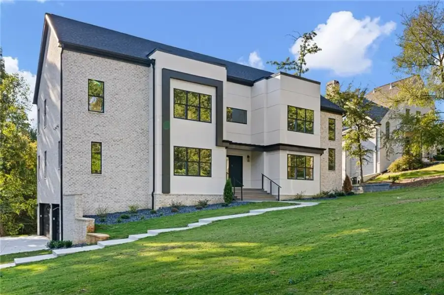 Front exterior of a new home in , Mableton, GA, highlighting curb appeal (Image 1). Front exterior of a new home in , Mableton, GA, highlighting curb appeal (Image 1).