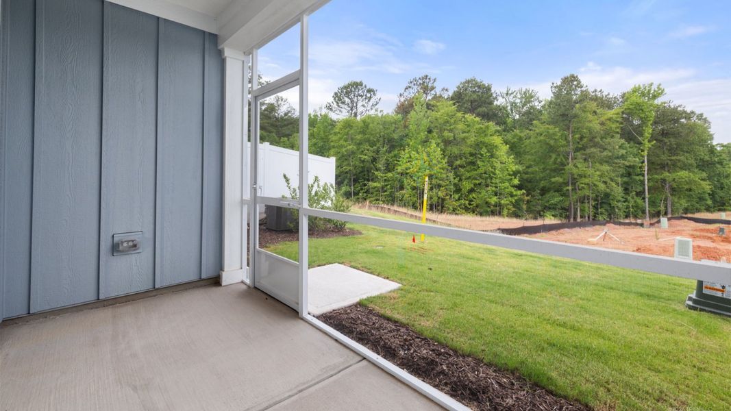 Exterior details and patio area of a home in The Courtyards at Oak Grove, Durham (Image 4).
