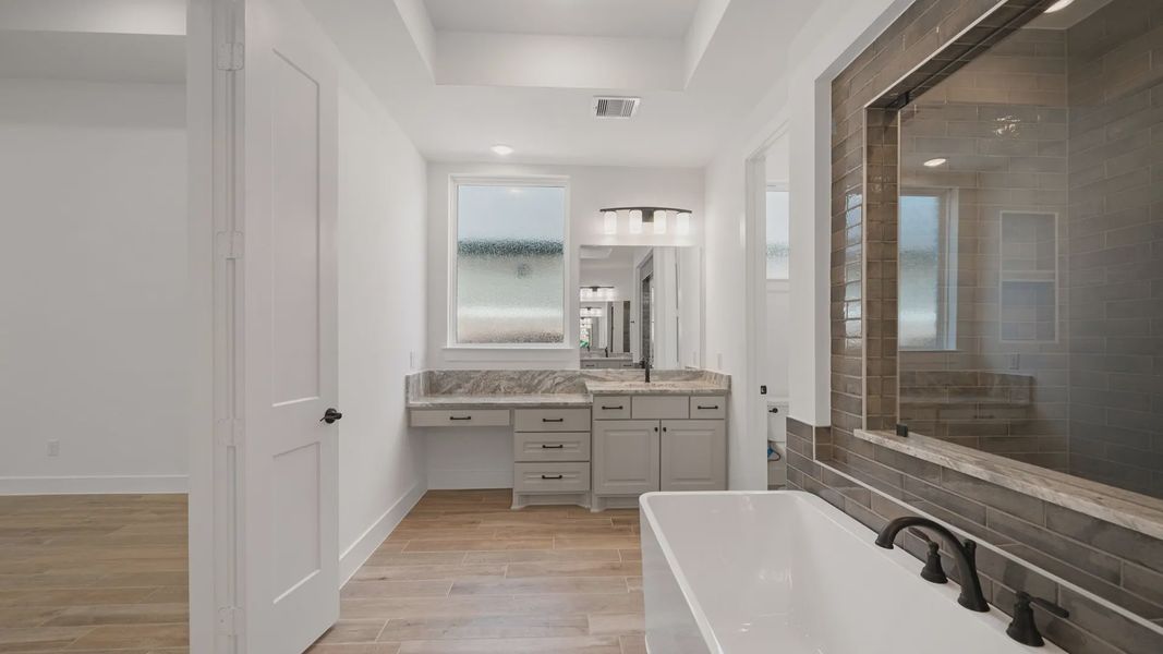 Representative furnished interior of a home built from the Waterloo by Chesmar Homes in Attwater 65's, Waller (Image 10).