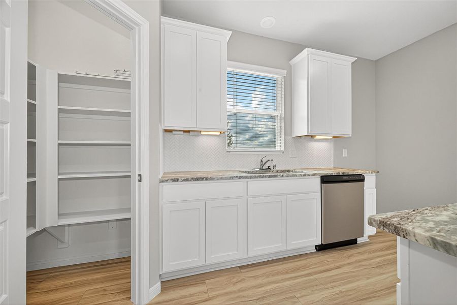 Furnished interior view inside a new home in Sunterra, Katy (Image 7).