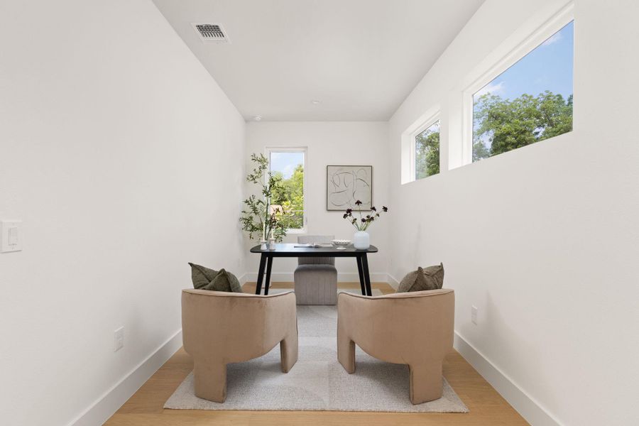 A quiet study space with light wood flooring provides a perfect work-from-home setting. A quiet study space with light wood flooring provides a perfect work-from-home setting.