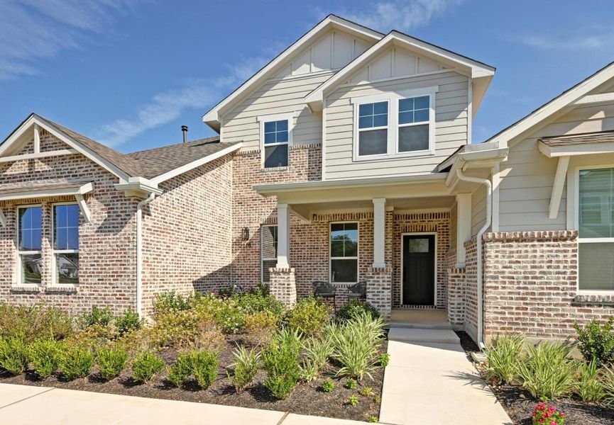 Front exterior of a new home in , Buda, TX, highlighting curb appeal (Image 27).