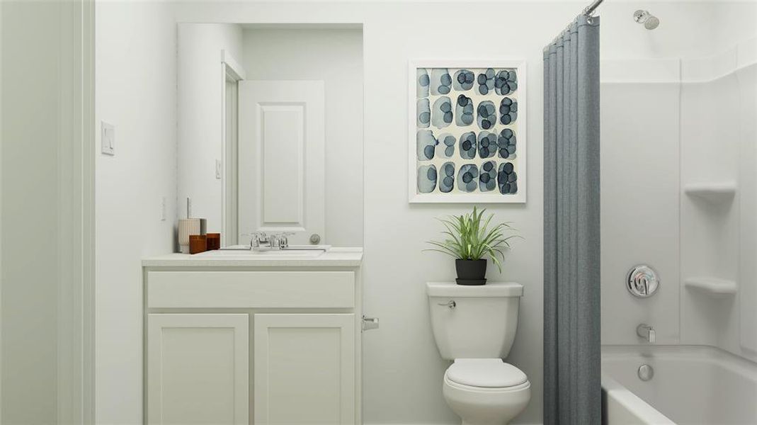 Full bathroom featuring vanity, shower / bathtub combination with curtain, and toilet