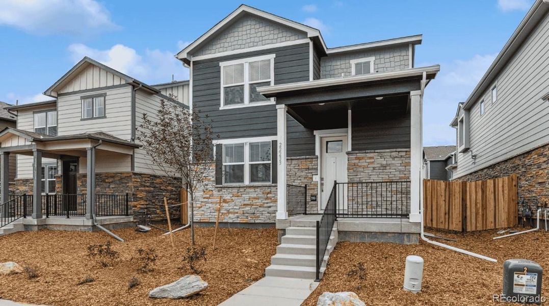 Exterior details and patio area of a home in Horizon Uptown, Aurora (Image 2). Exterior details and patio area of a home in Horizon Uptown, Aurora (Image 2).