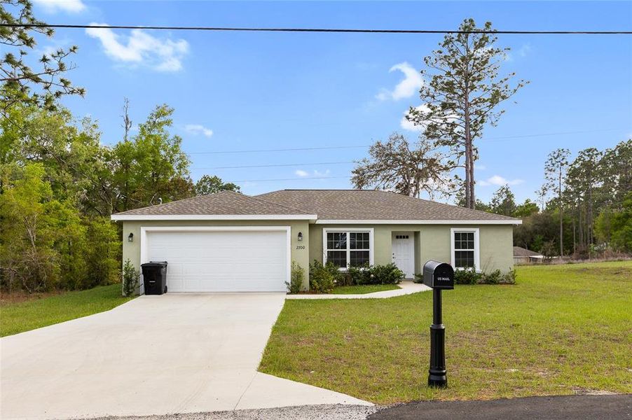 Front exterior of a new home in , Dunnellon, FL, highlighting curb appeal (Image 22).