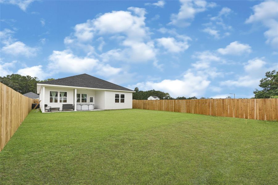 Exterior details and patio area of a home in , Conroe (Image 3).