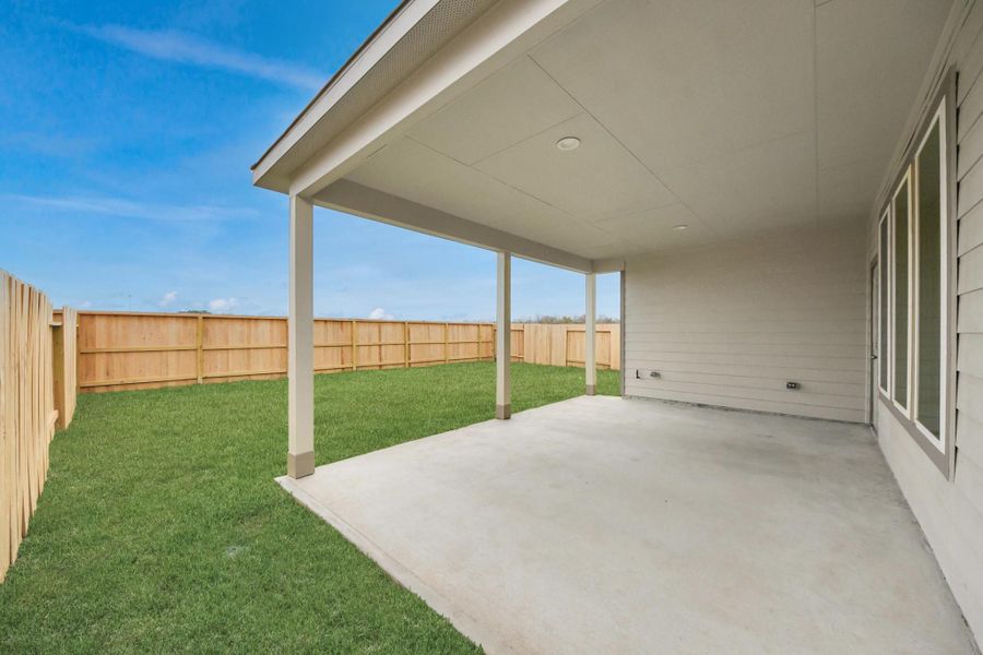 Experience outdoor living at its finest on this expansive covered patio, thoughtfully designed for BBQs and delightful outdoor dining. Sample photo of completed home with similar floor plan. Actual colors and selections may vary. Experience outdoor living at its finest on this expansive covered patio, thoughtfully designed for BBQs and delightful outdoor dining. Sample photo of completed home with similar floor plan. Actual colors and selections may vary.