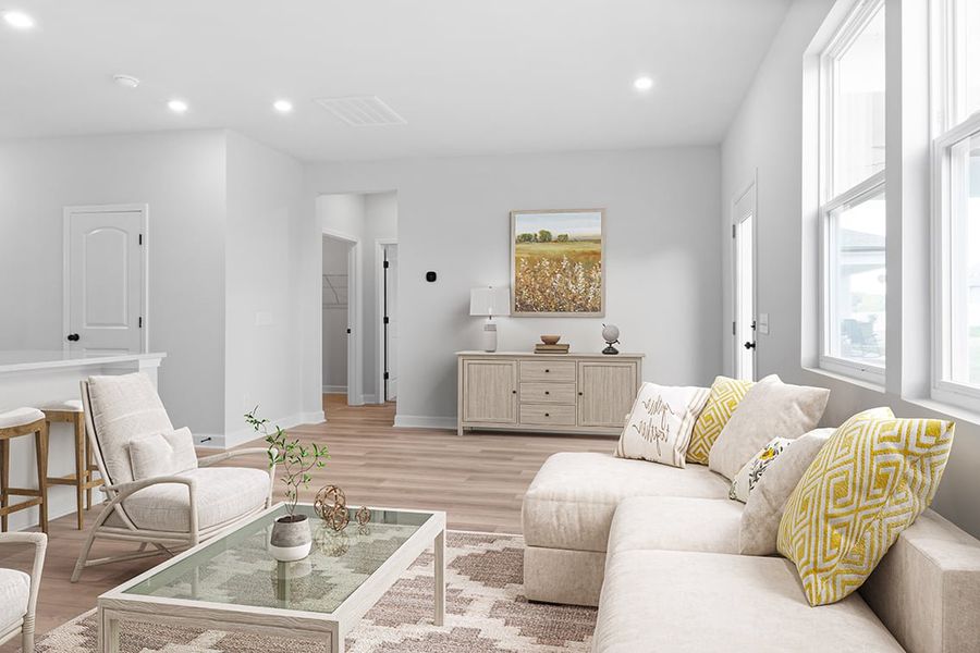 A living room with a couch and a coffee table. A living room with a couch and a coffee table.